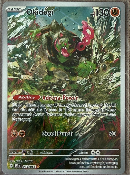 Near Mint - Okidogi 74/64 - Scarlet & Violet: Shrouded Fable